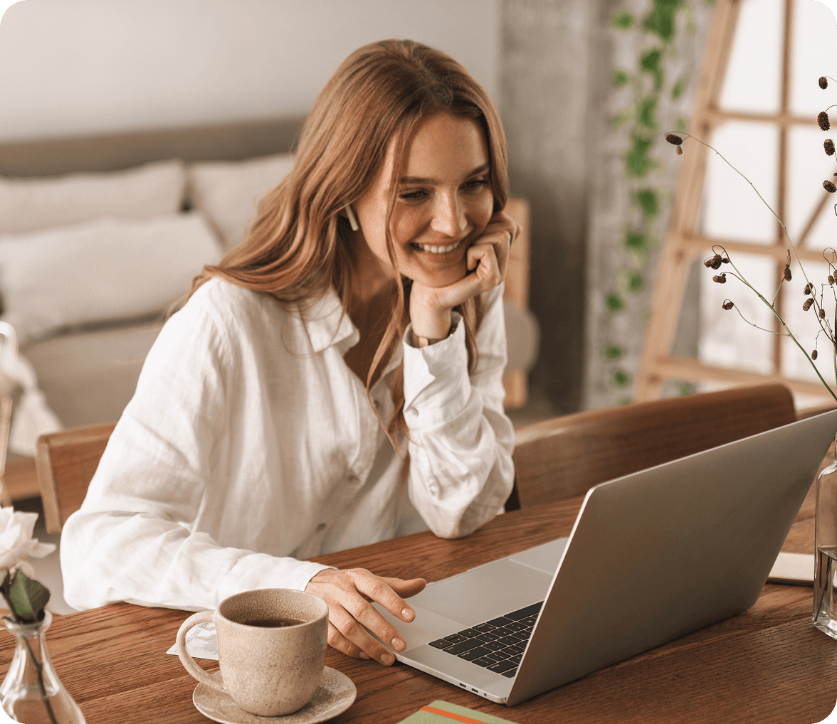 A woman working at her laptop.